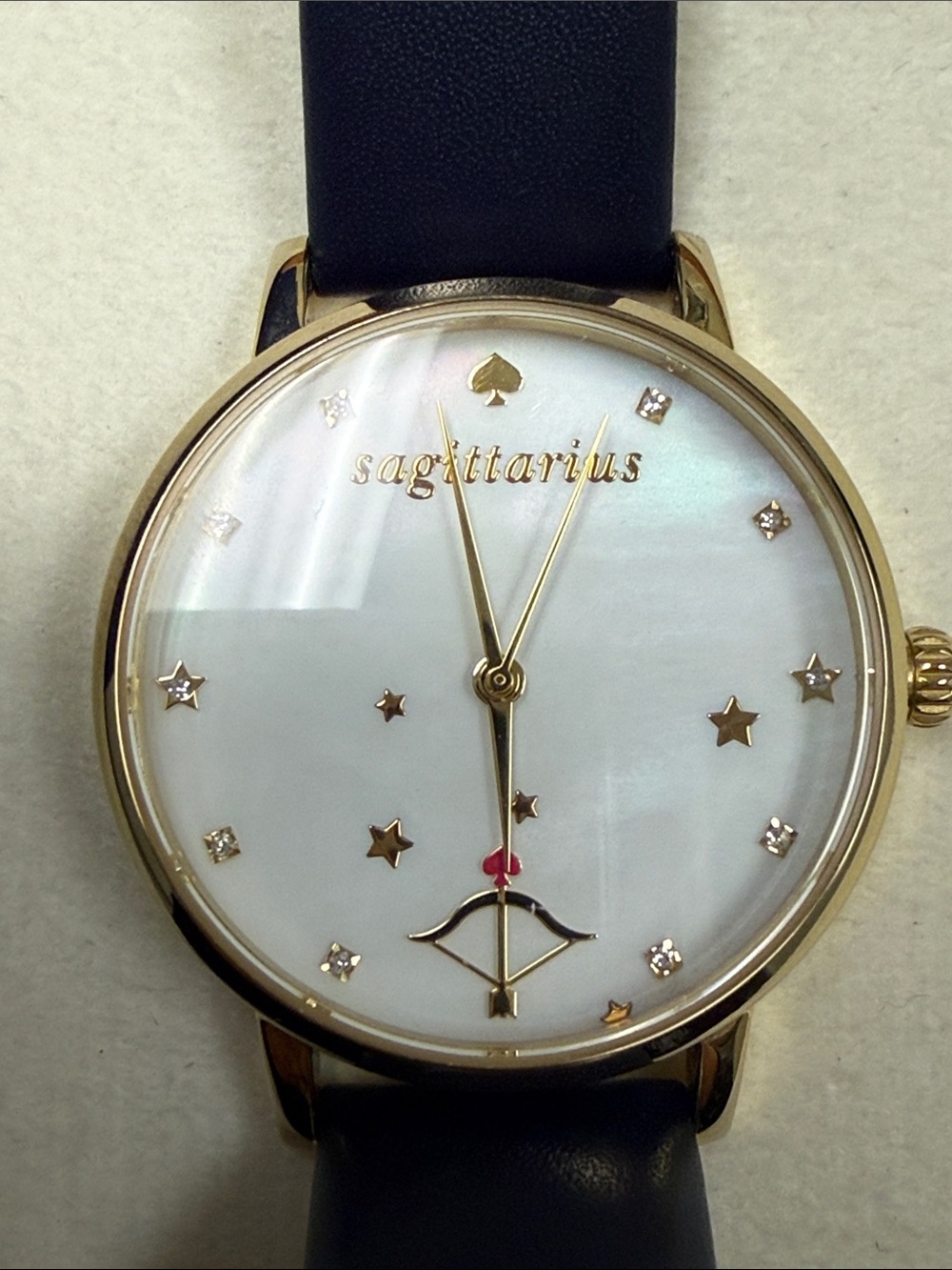 kate spade Gold-Tone Sagittarius Watch with Black Strap and Mother-of-Pearl Dial